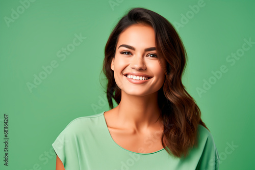 medium shot portrait photography of a pleased woman in her 30s against a light green background © Enrique