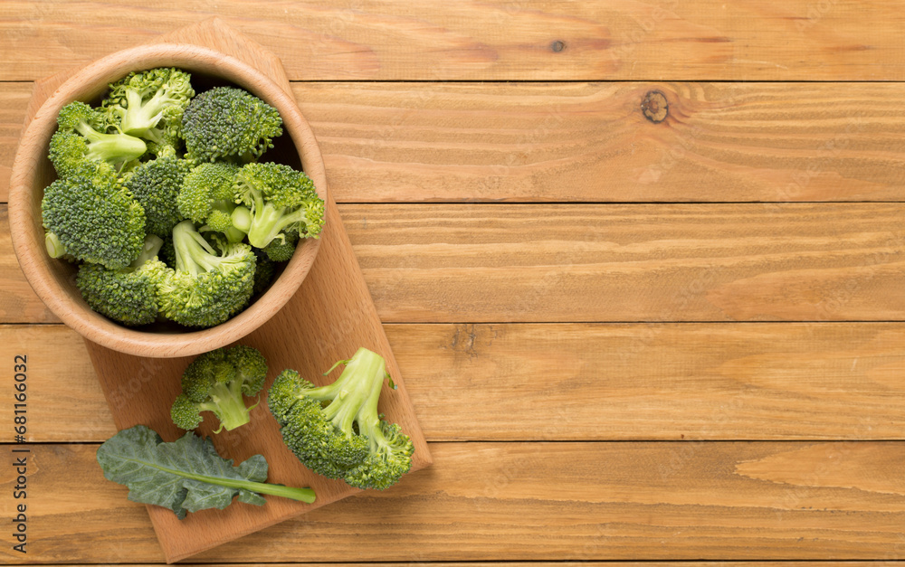 Fresh tasty broccoli on wooden background, top view Fresh tasty broccoli on wooden background, top view