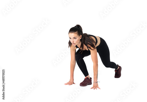 Female athlete in position to start running - isolated on transparent background