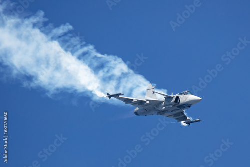 Military fighter jet plane at air base. Airport and airfield. Air force flight operation. Aviation and aircraft. Air defense. Military industry. Fly and flying.