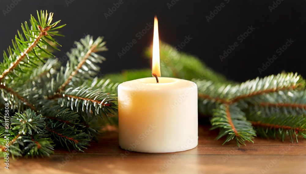 Candle burning on table and fir branch Candle burning on table and fir branch