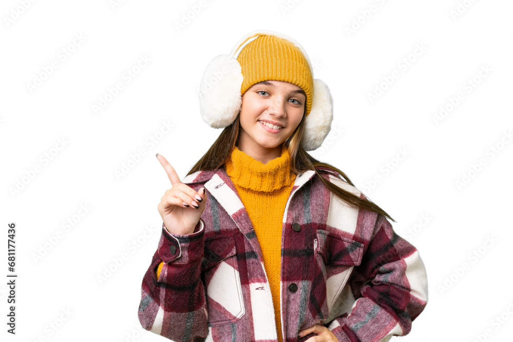 Teenager caucasian girl wearing winter muffs over isolated background showing and lifting a finger in sign of the best Teenager caucasian girl wearing winter muffs over isolated background showing and lifting a finger in sign of the best