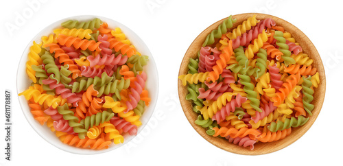 raw Fusilli colored pasta in bowl isolated on white background with full depth of field. Top view. Flat lay