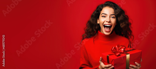 Happy Young Woman Holding a...