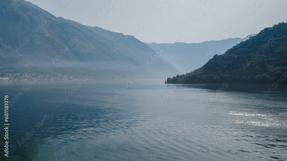 View on the sea bay covered with morning fog. Kotor bay, Montenegro View on the sea bay covered with morning fog. Kotor bay, Montenegro