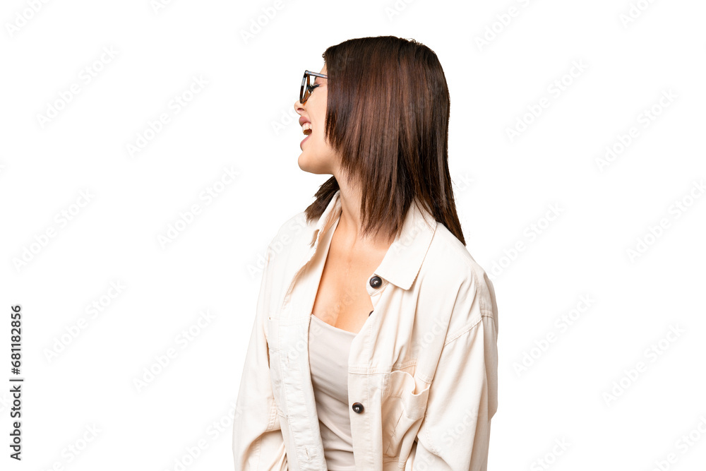 Young Russian woman over isolated chroma key background laughing in lateral position Young Russian woman over isolated chroma key background laughing in lateral position