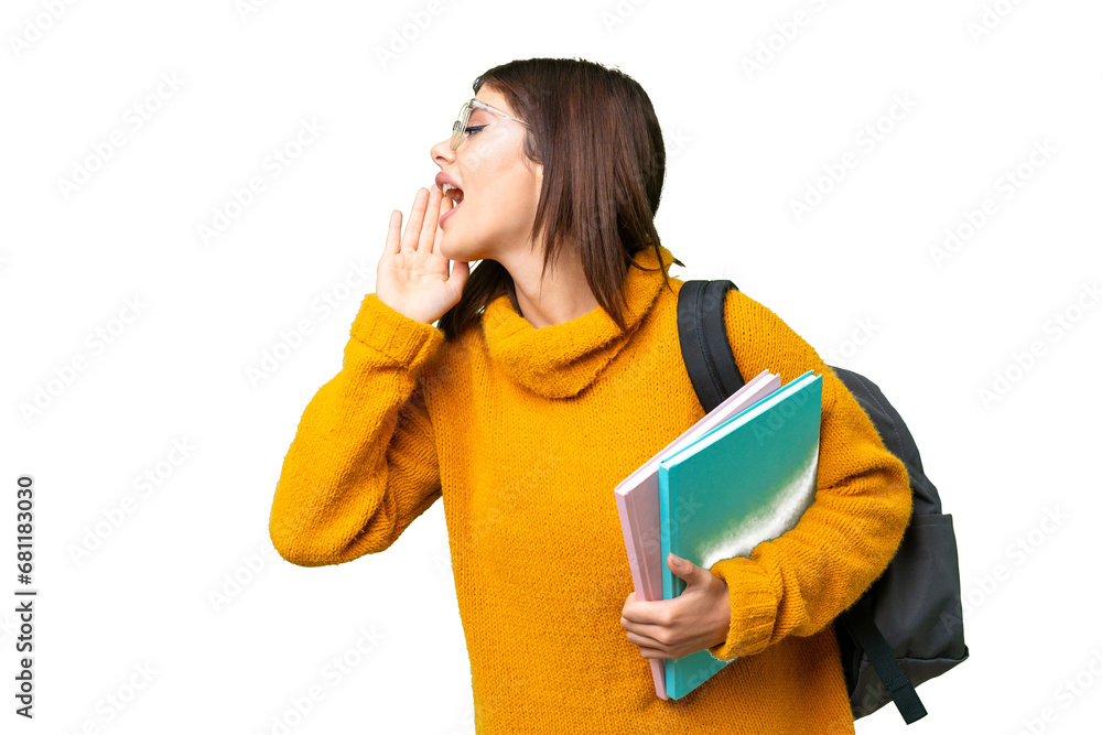 Young student woman over isolated chroma key background shouting with mouth wide open to the side Young student woman over isolated chroma key background shouting with mouth wide open to the side
