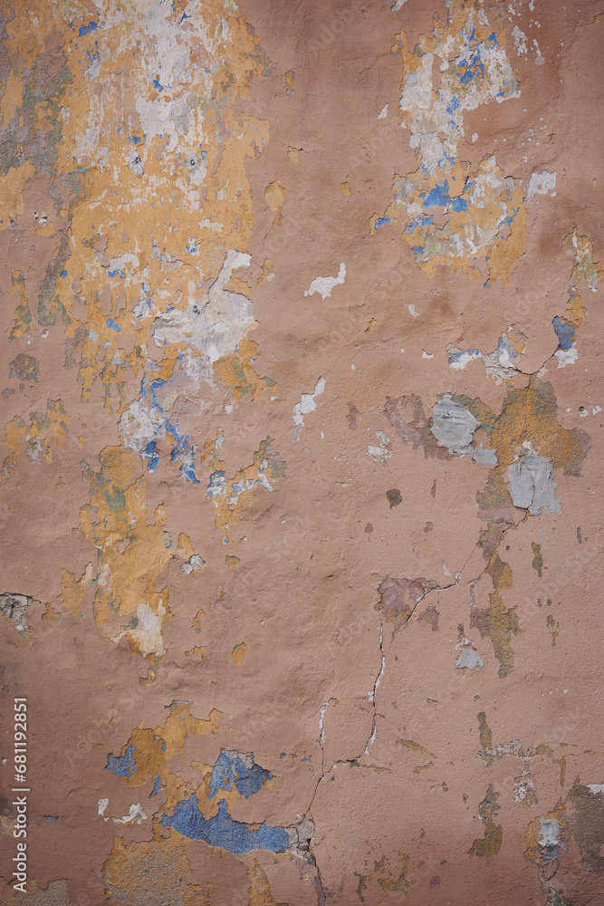 Cracked wall with old layers of paint in abandoned house. Texture of old wall with cracks, dents and peeling paint. Weathered rough painted surface with patterns of cracks and peeling. Grunge texture. Cracked wall with old layers of paint in abandoned house. Texture of old wall with cracks, dents and peeling paint. Weathered rough painted surface with patterns of cracks and peeling. Grunge texture.