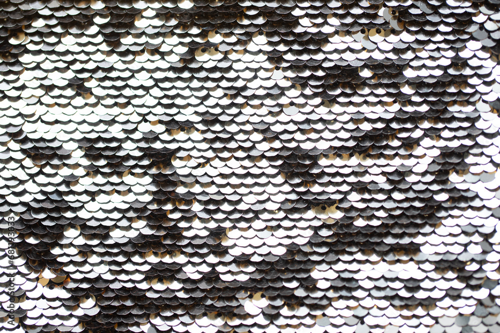 Naklejka premium Silver round shaped sequins attached to the fabric. Background texture