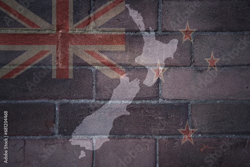 map and flag of new zealand on a old brick wall © luzitanija