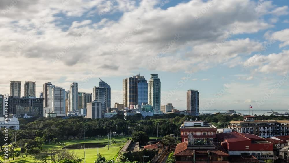 Time lapse of the clouds moving above tall buildings in Manila, Philippines. Time lapse of the clouds moving above tall buildings in Manila, Philippines.