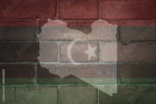 map and flag of libya on a old brick wall