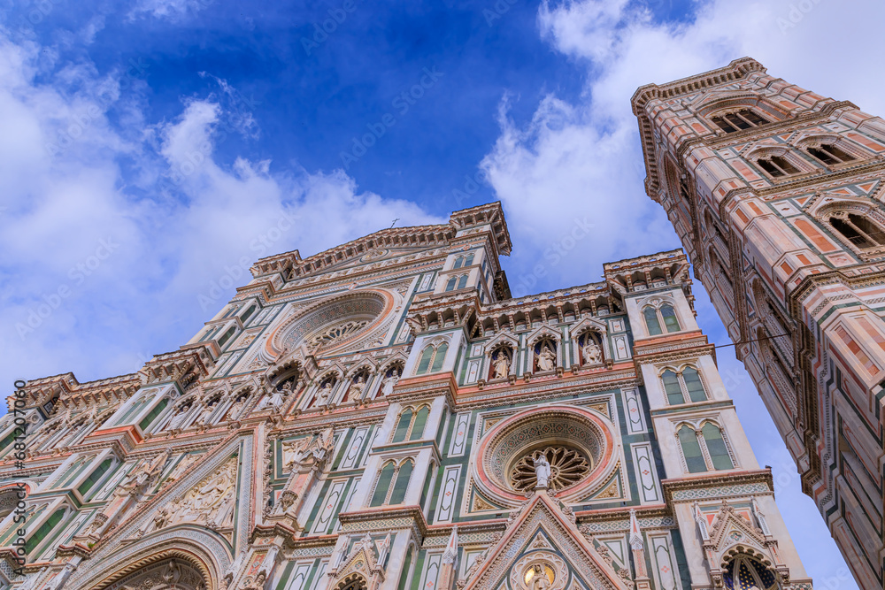 Typical urban view of Florence: the main facade of Cathedral of Santa Maria del Fiore with Giotto's Bell Tower, Italy.