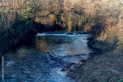 The River Rye on its journey into Leixlip Town, Kildare ireland. it is a major tributary of the River Liffey which it meets in the centre of the town. photo