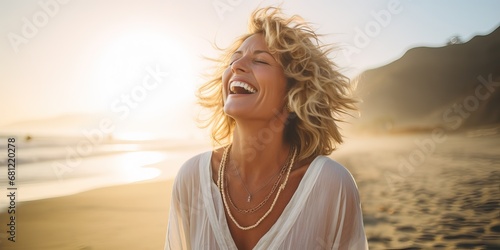 Smiling mature woman at the beach, natural lifestyle, enjoying the sunny weather on beach coast