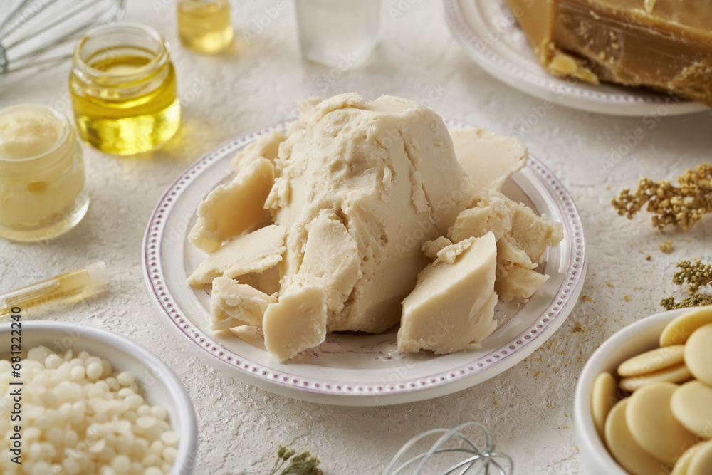Pieces of shea butter with beeswax, cocoa butter and essential oils - ingredients for natural cosmetics Pieces of shea butter with beeswax, cocoa butter and essential oils - ingredients for natural cosmetics