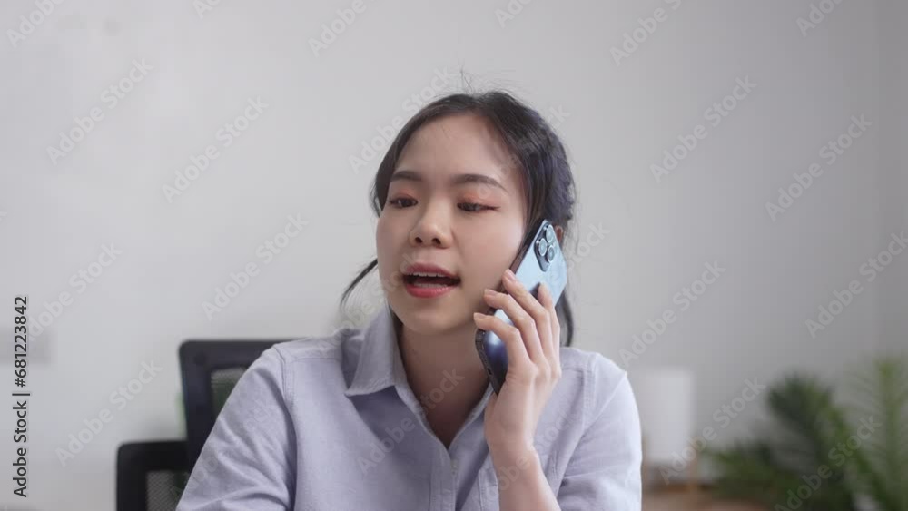 Young female making business call talking on the phone Young female making business call talking on the phone