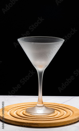 Crystal glass, without drink, on a black background on a marble table
