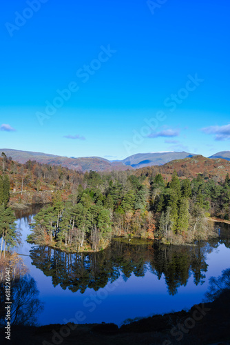 Lake District Cumbria, Tarn Hows, flat calm with reflections and blue sky