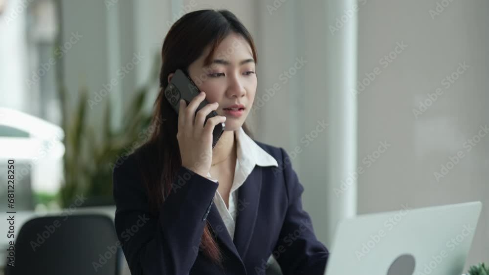 Young female making business call talking on the phone Young female making business call talking on the phone