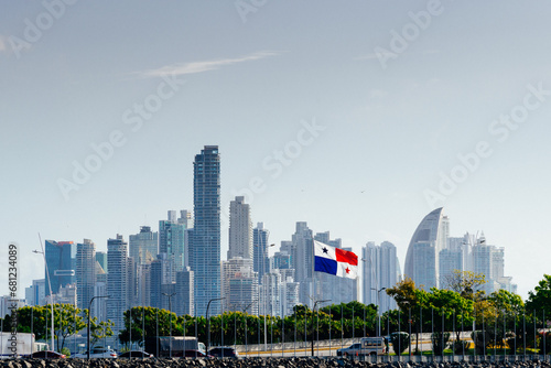 city ​​skyline of panama city skyscrapers with the flag of panama in the foreground