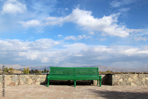 old wooden bench on a terrace in the mountains (ID: 681234876)