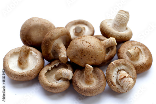 Fresh shiitake mushrooms on white background.