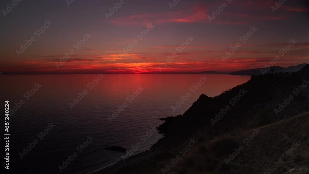 Seascape.Sunset over sea coast. View from cliffs of Maro Cerro Gordo Natural Park, Malaga province, Costa Del Sol, Andalusia, Spain. Time lapse Seascape.Sunset over sea coast. View from cliffs of Maro Cerro Gordo Natural Park, Malaga province, Costa Del Sol, Andalusia, Spain. Time lapse