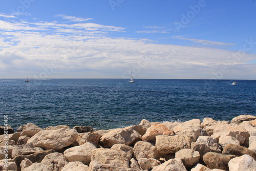Boat sailing in a turquoise ocean in Cassis, France