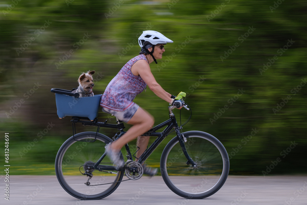 moving bike with rider and dog