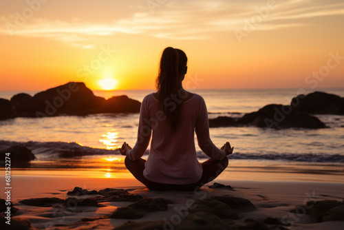 A young woman practicing yoga on a tranquil beach at sunrise, finding inner peace and mindfulness. Concept of wellness and serenity. Generative Ai.