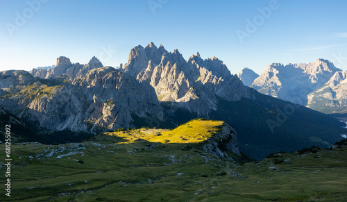 Amazing views of the picturesque high Dolomites mountains  lawns and summer forest
