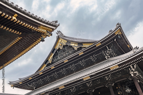 Curved rooftops in the Higashi Honganji temple in Kyoto, Japan (Translated text in tiles inscription: “Honganji”).
Very elaborate roof details in this famous Buddhist temple.
 photo