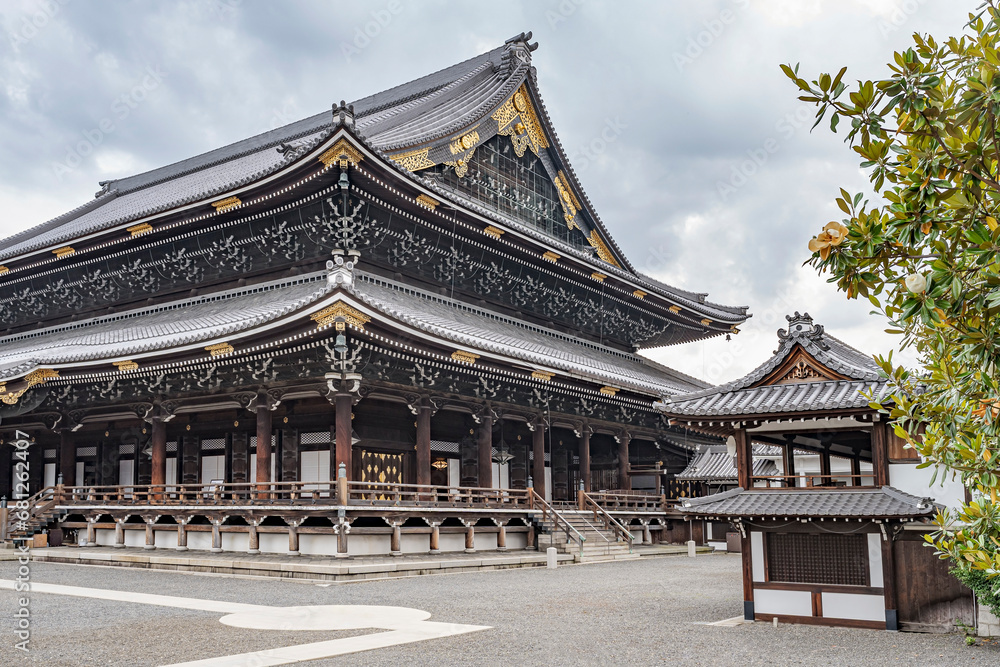 Beautiful view of the majestic temple Higashi Honganji in Kyoto, Japan.
Very elaborate construction of wood and golden decorations on this temple.
Beautiful view of the majestic temple Higashi Honganji in Kyoto, Japan.
Very elaborate construction of wood and golden decorations on this temple.