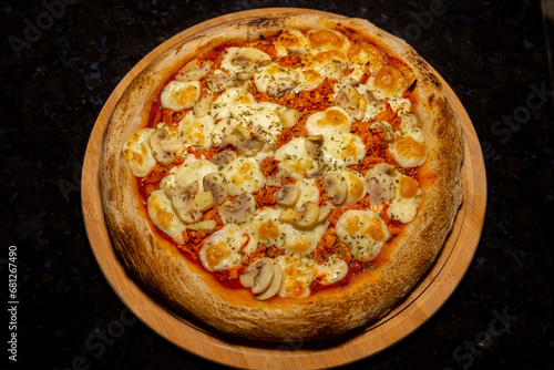 Traditional Brazilian chicken pizza with catupiry cheese and mushrooms