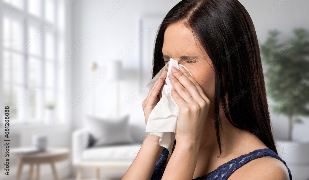 sick young woman sneezing with allergy or flu sick young woman sneezing with allergy or flu