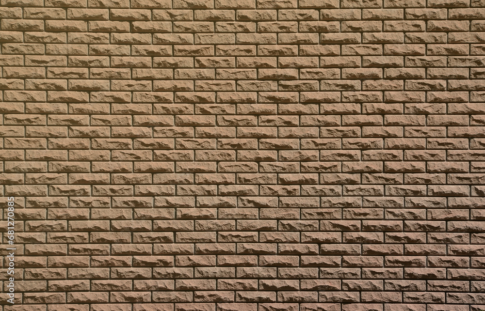 Texture of brick wall from relief stones under bright sunlight Texture of brick wall from relief stones under bright sunlight