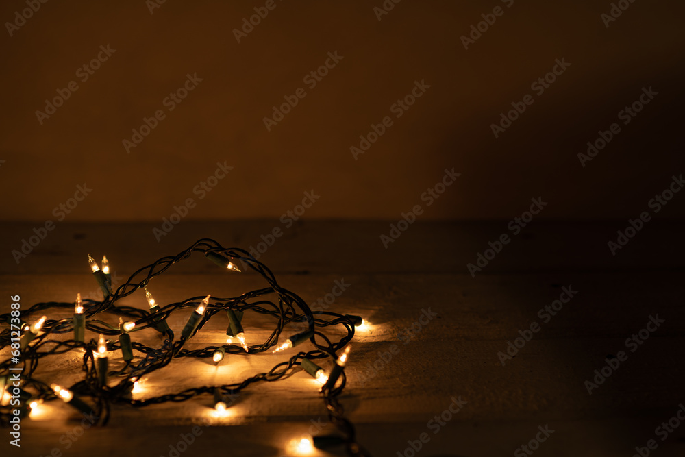Warm white lights string with a gold glow and a shallow depth of field