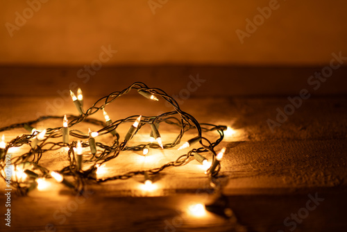 Warm white lights string with a gold glow and a shallow depth of field