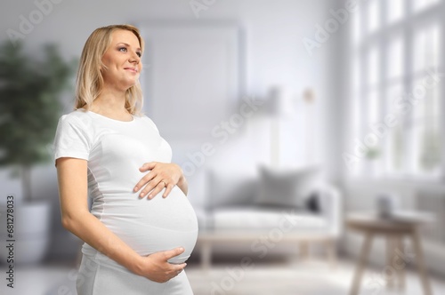 Happy young pregnant woman at home Free Download Happy young pregnant woman at home - GFXLoad