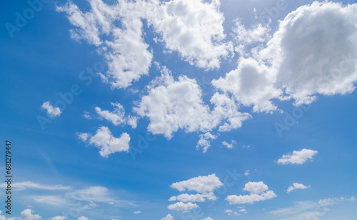 Fototapeta Naklejka Na Ścianę i Meble -   Panoramic view of clear blue sky and clouds, Blue sky background with tiny clouds. White fluffy clouds in the blue sky. Captivating stock photo featuring the mesmerizing beauty of the sky and clouds.