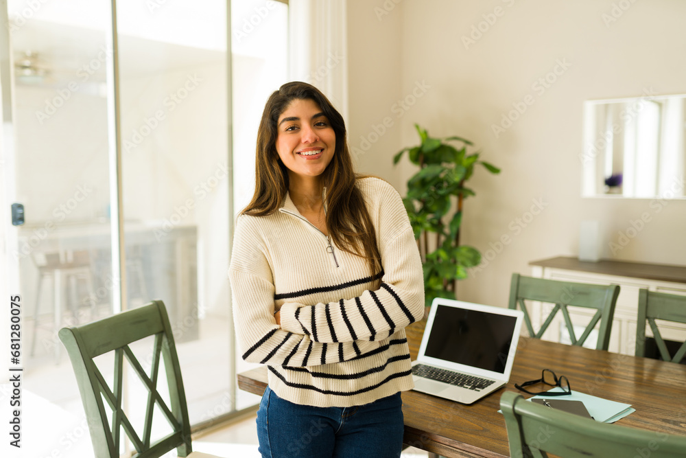 Hispanic woman happy about doing remote work