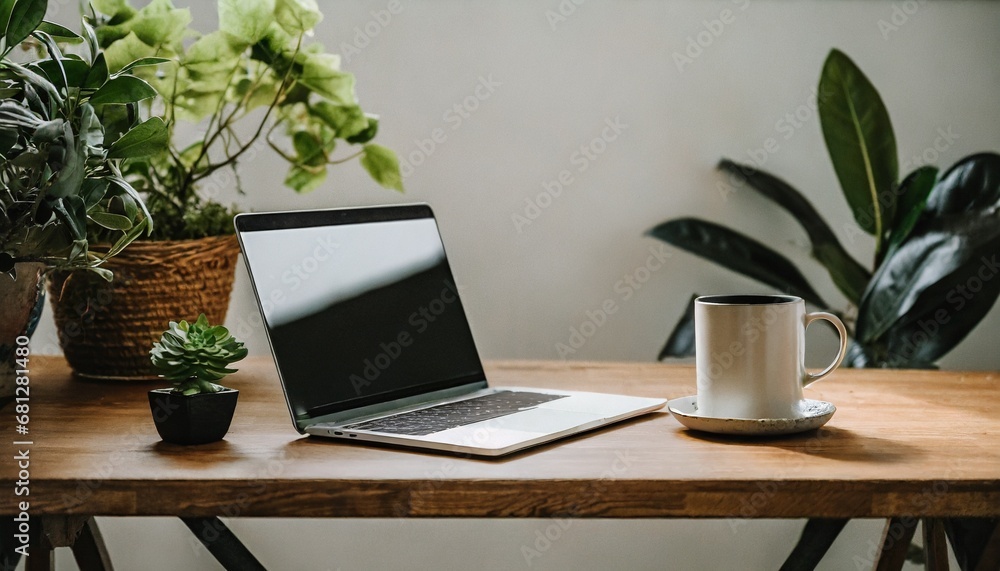 laptop on the table, Relaxed work environment on a wooden table, laptop screen blank, coffee mug, and a hint of greenery from a potted plant, , tranquil workspace