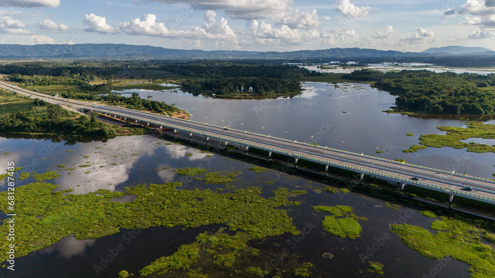 Aerial view of the long bridge build for crossing Nong Luang the largest lake in Wiang Chai district of Chiang Rai province of Thailand.
