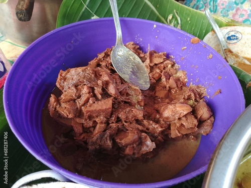 delicious gudeg on purple bowl. gudeg is traditional indonesian food