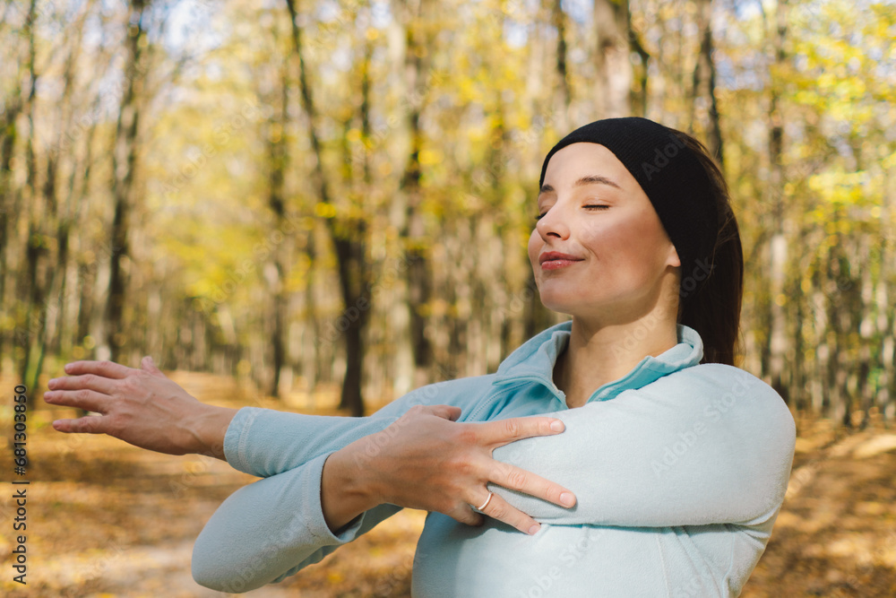 Beautiful girl doing fitness in nature on a sunny autumn forest. Body positive, sports for women, harmony, healthy lifestyle, self-love and wellness. Beautiful girl doing fitness in nature on a sunny autumn forest. Body positive, sports for women, harmony, healthy lifestyle, self-love and wellness.