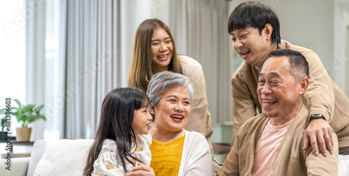 Portrait of happy love family asian father and mother playing with adorable asian kid girl.daughter, care, insurance.Happy family moments good time love with grandparents.Love of big family