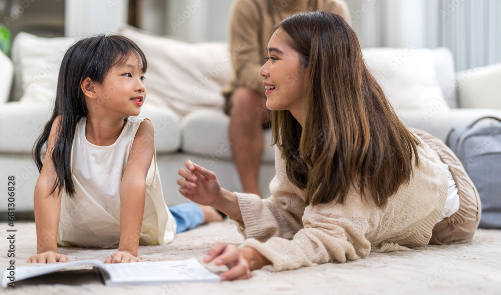 Portrait happy love asian family mother teach little daughter asian girl learn and study.Mom and asian young girl reading book and pencil making lessons in homeschool at home.Education Portrait happy love asian family mother teach little daughter asian girl learn and study.Mom and asian young girl reading book and pencil making lessons in homeschool at home.Education