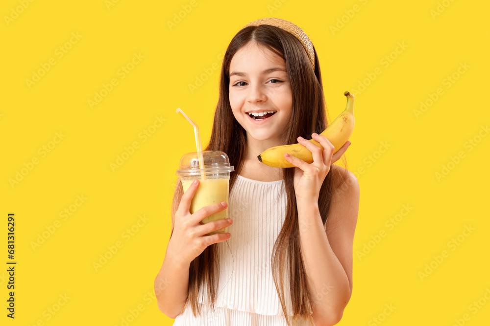 Little girl with glass of smoothie and banana on yellow background Little girl with glass of smoothie and banana on yellow background