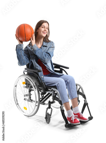 Young woman in wheelchair with ball on white background